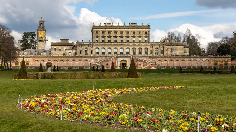 View of the parterre in spring with Cliveden House in the background